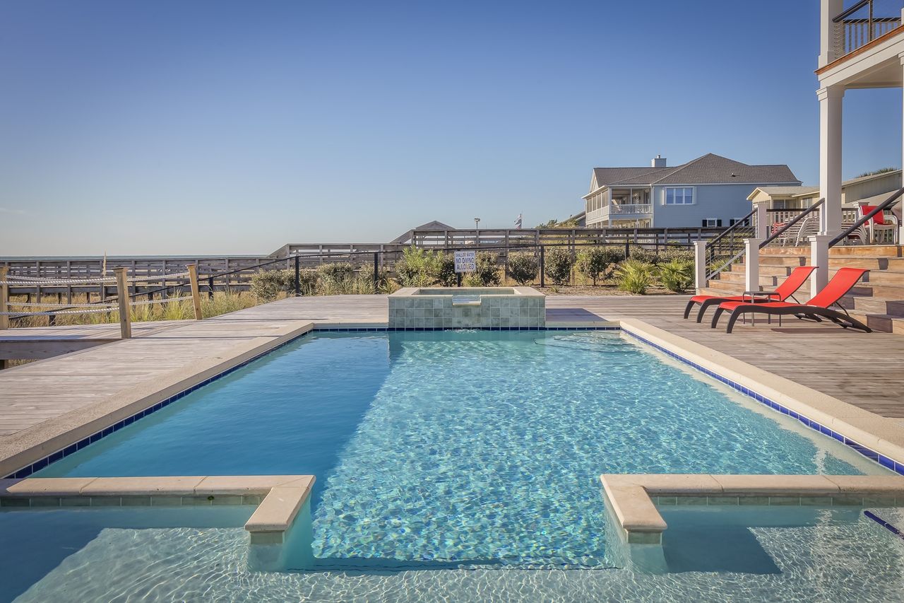 A crystal-clear pool serviced by EDY Pool Service